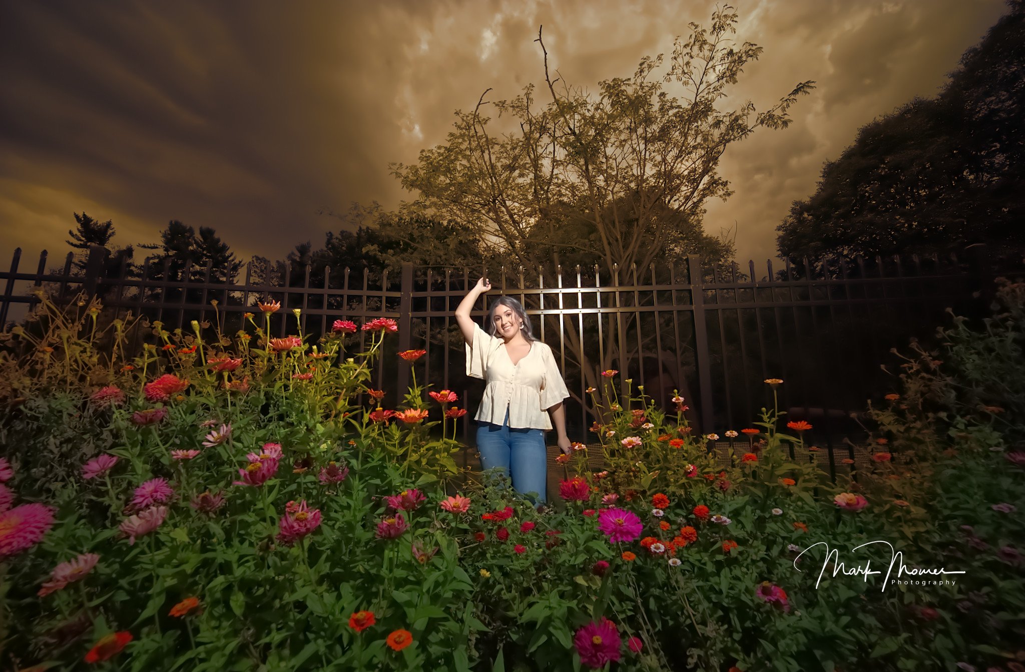 Senior portrait — Madison in flower garden at dusk